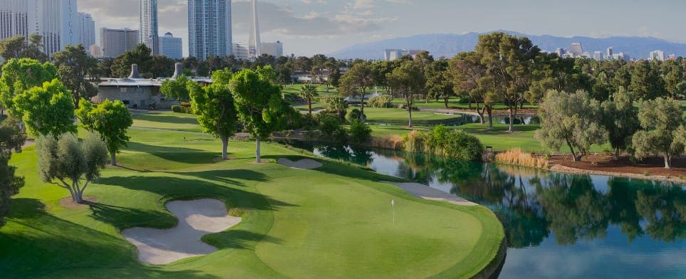 Aerial view of Las Vegas Country Club Estates with the Las Vegas skyline in the background